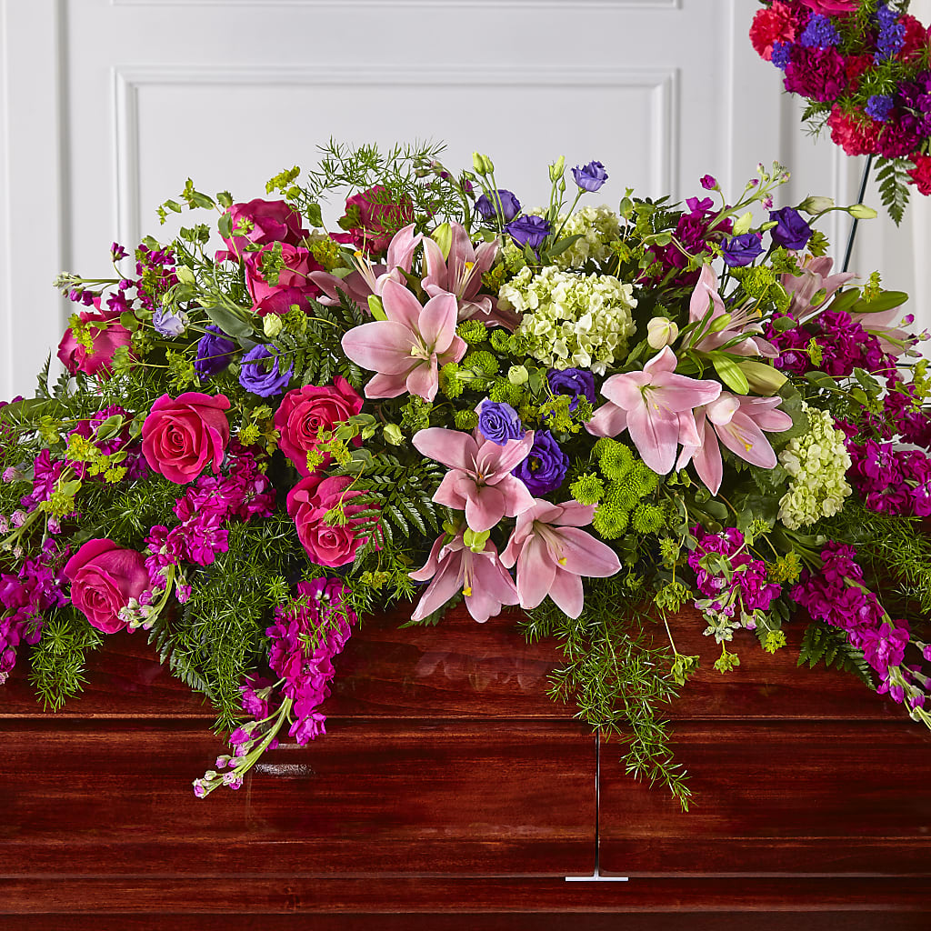 Radiant Tribute Casket Spray – Herbert E Berg Florist Inc, Worcester MA
